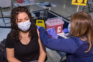 Nurse giving a vaccine